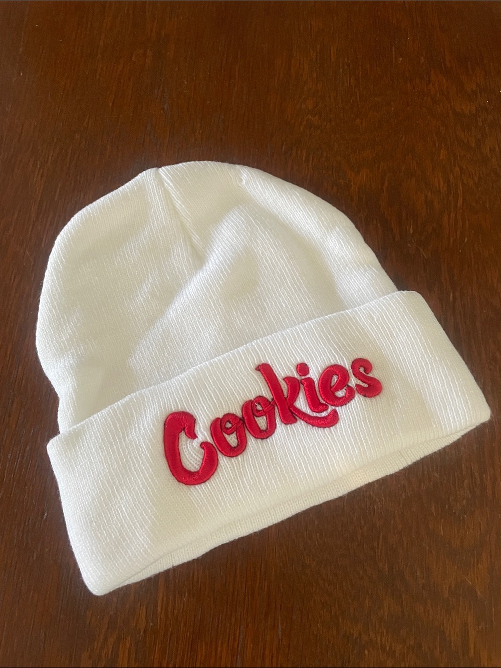 White beanie with red letteres saying COOKiES new one size